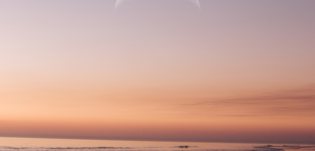 pink and purple sunset over an ocean
