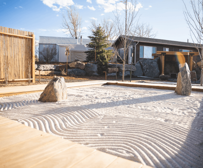 Explore the Gardens at The Beam and Bell large sand box with lines