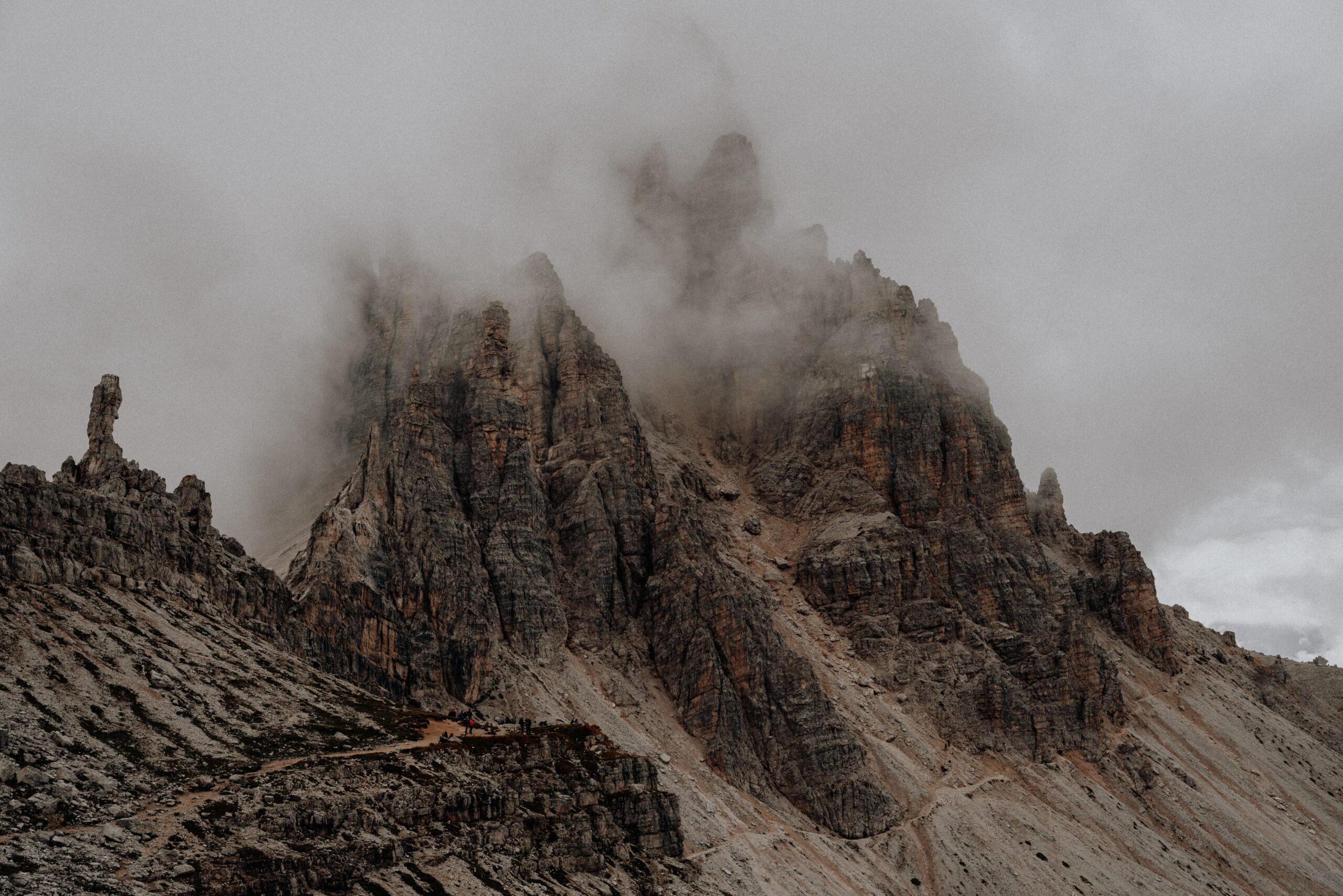 Looking Back at 2021: The Year of Self-Care large spiky dark brown mountains in a cloud