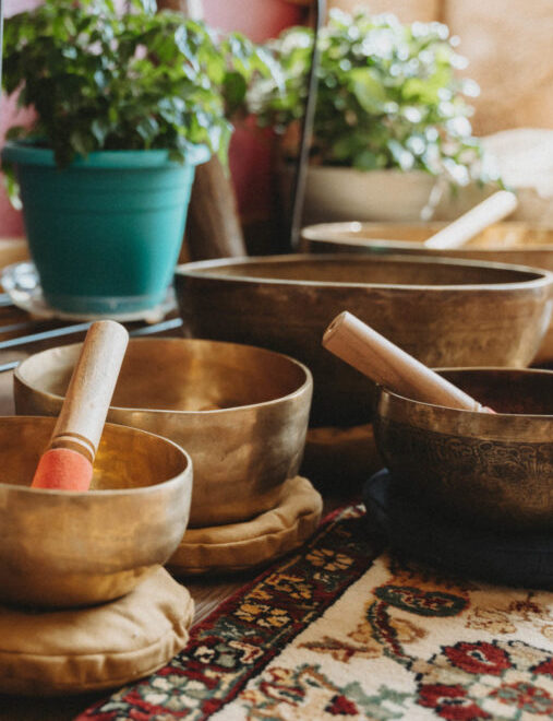 Brass singing bowls on a floor