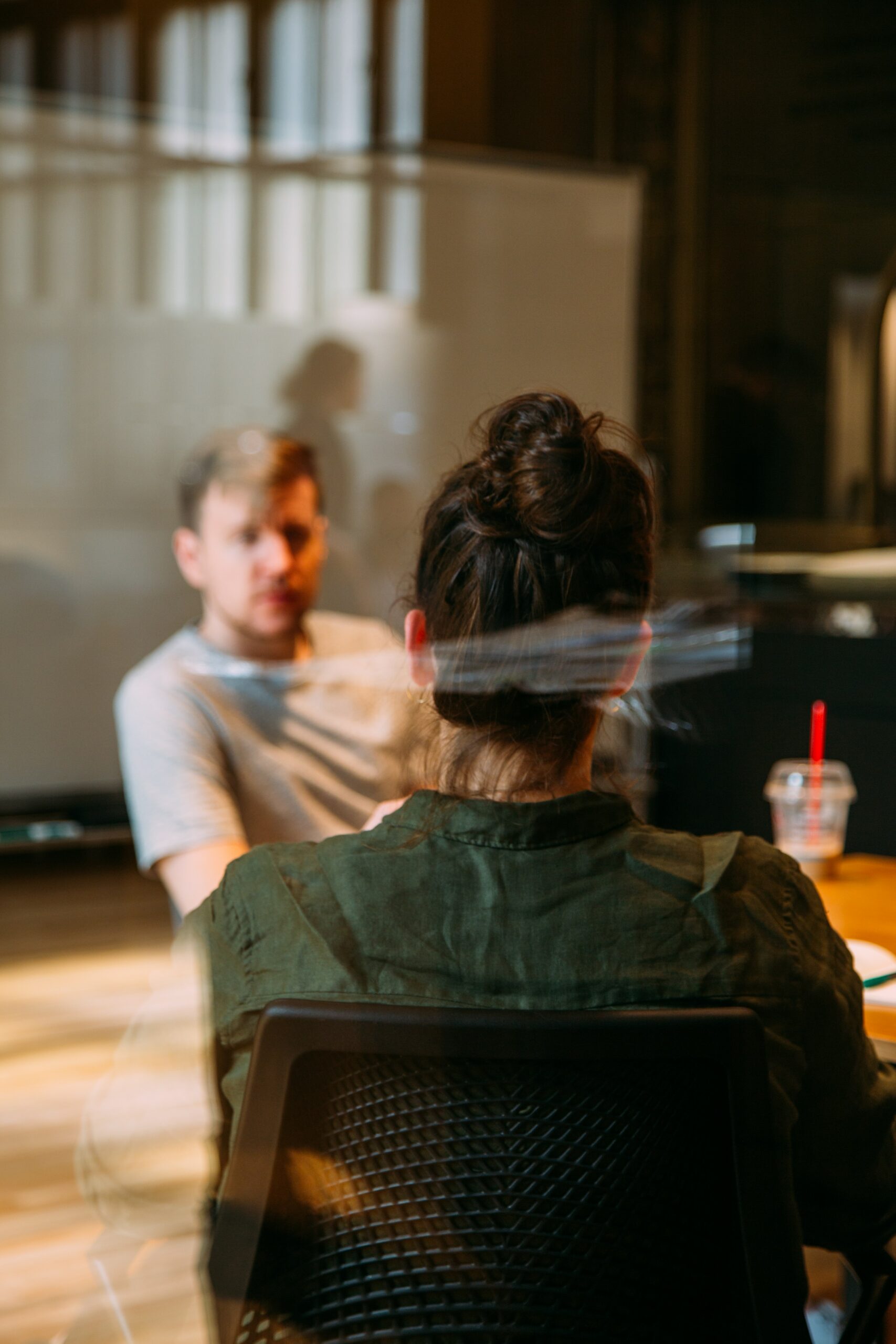 76: What to Do With Unsolicited Advice a man and a woman talking in a cafe