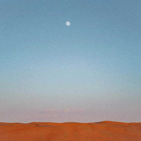 81: Guided Meditation for Love, Peace, and Self-Care a full moon in a blue sky over an orange desertscape