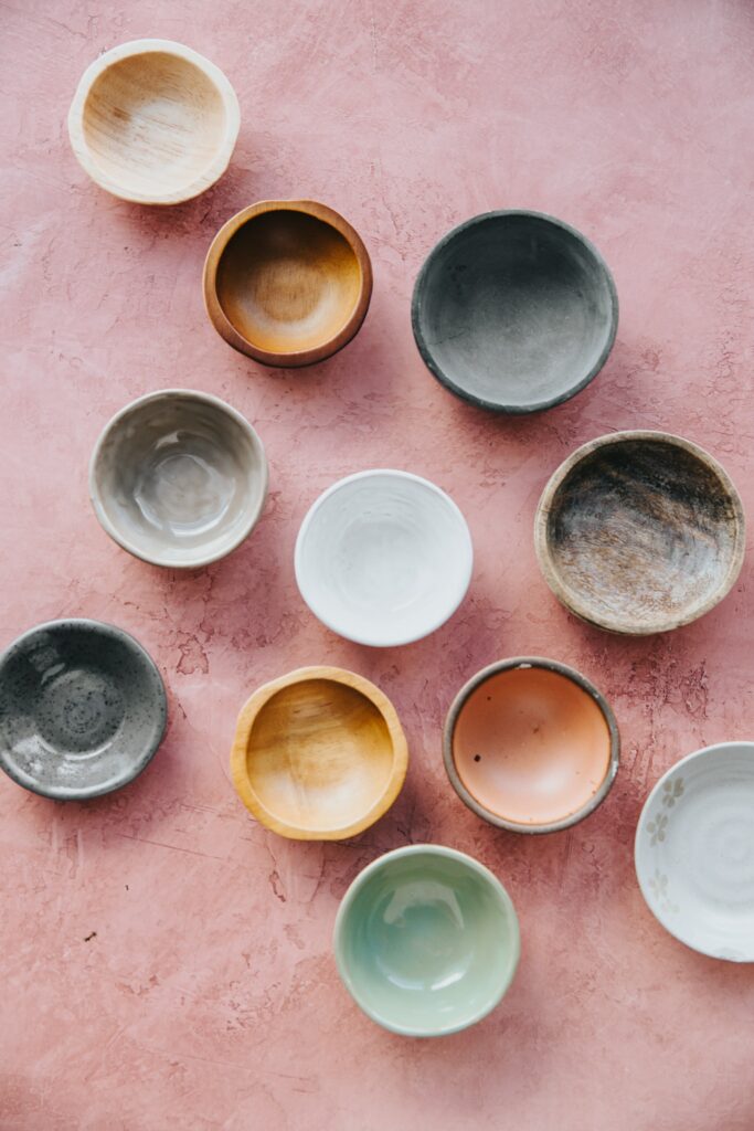 51: 5 Lessons Pottery Has Taught Me birds eye view of multiple bowls on a pink surface