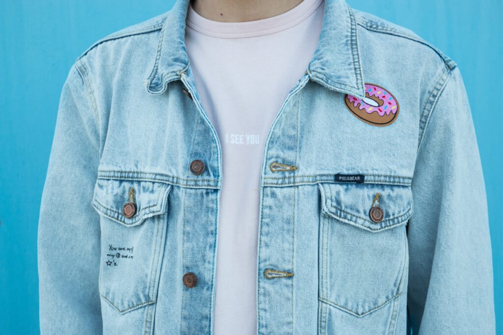close up of a person wearing a jean jacket