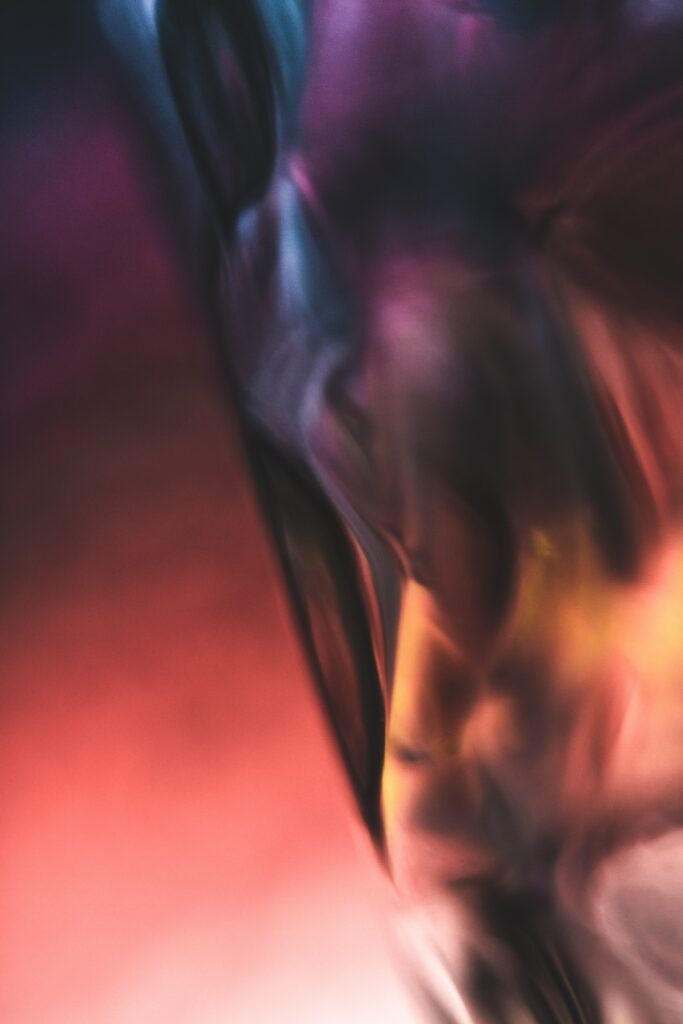 close up of a blurry red purple and yellow shape