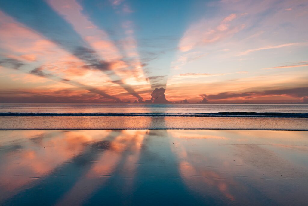 Is there a "right way" to meditate? a blue, pink, and orange sunset over a large body of calm water